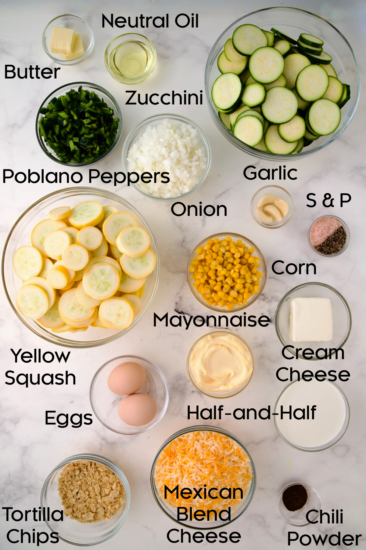 Ingredients for Summer Squash Corn Poblano Casserole in glass bowls.