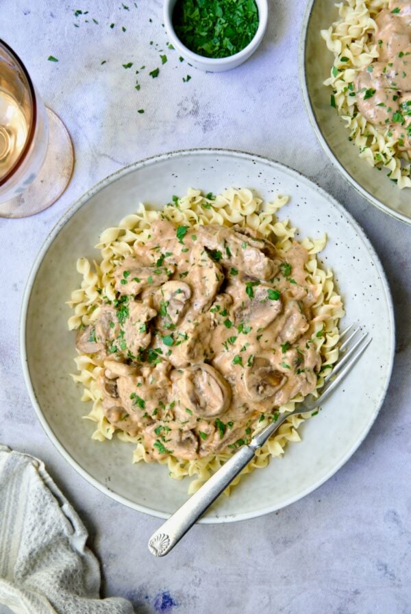 One serving of Beef Stroganoff in shallow bowl.
