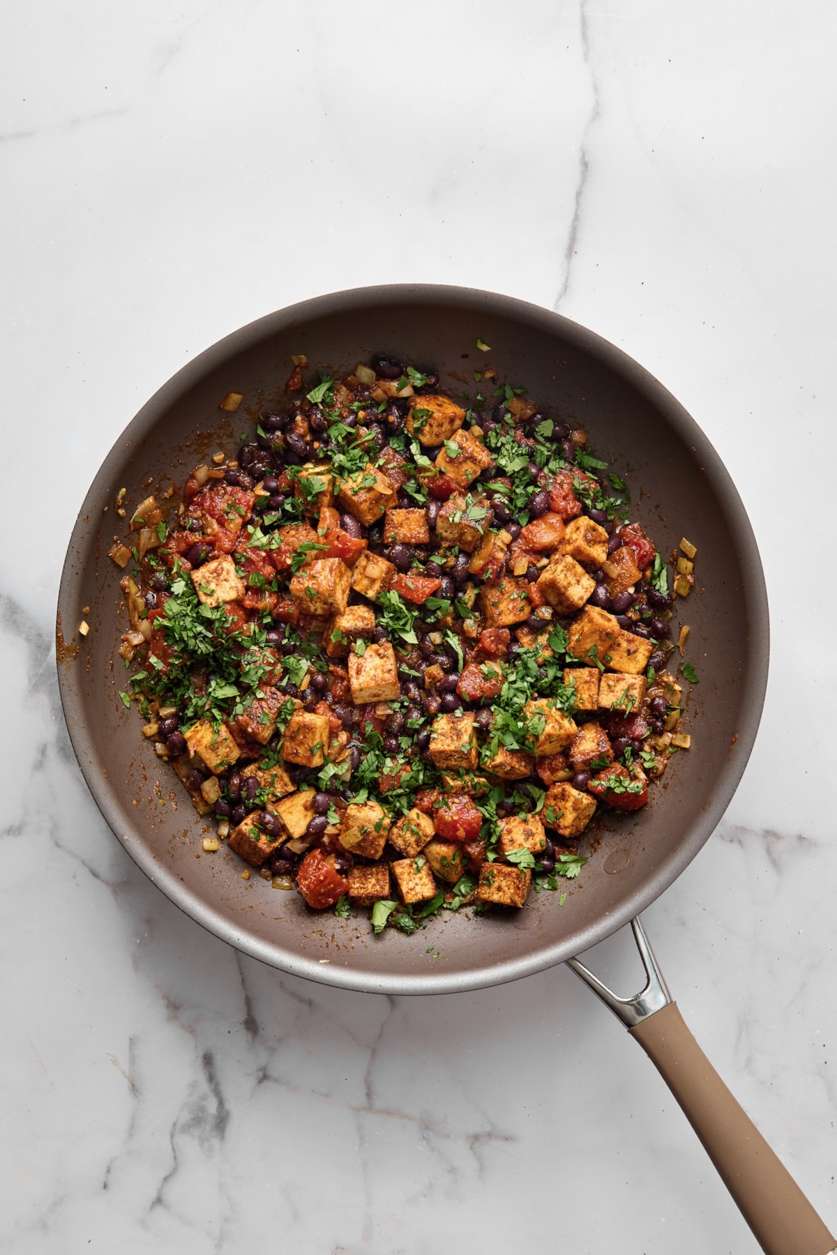 Finished tofu and black bean taco filling in nonstick skillet.