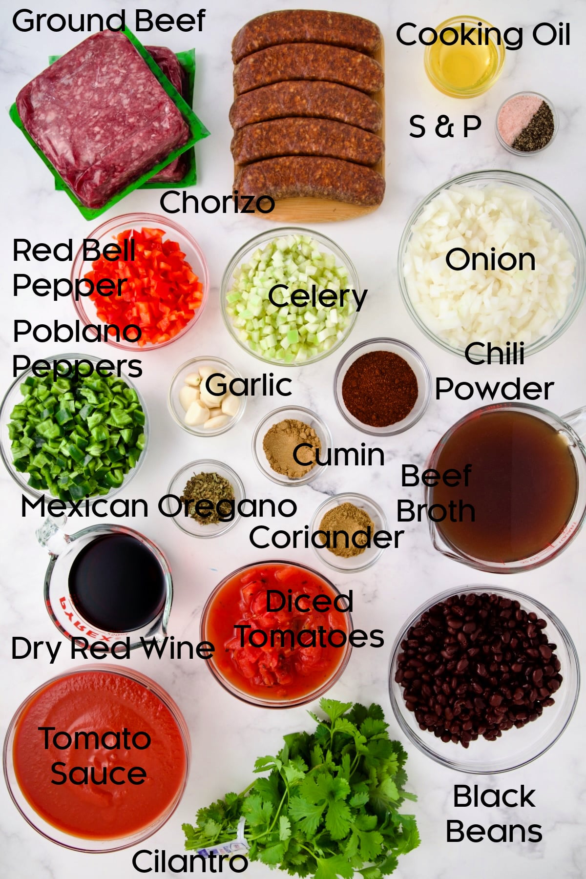 Ingredients for Beef and Chorizo Chili in glass bowls.