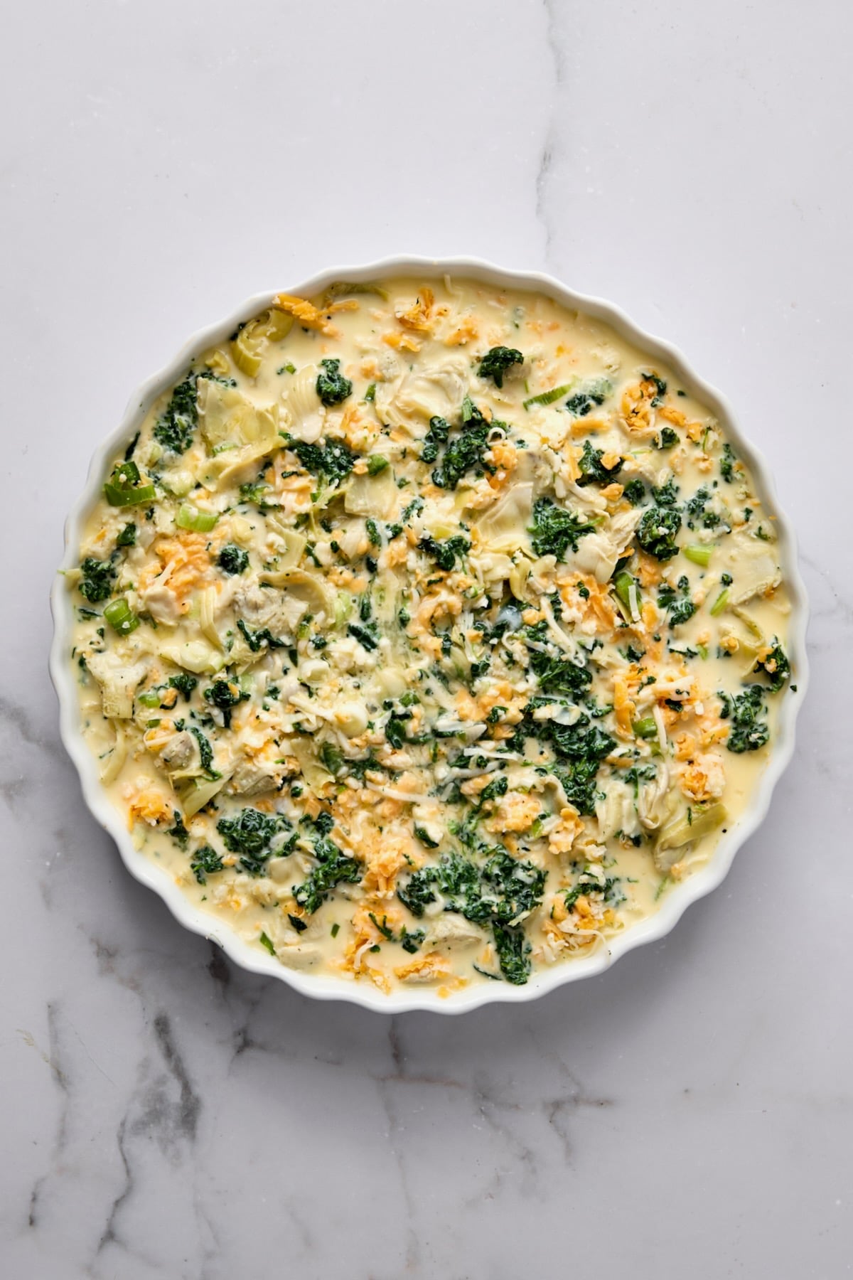 Crustless Spinach Artichoke Quiche before being baked.