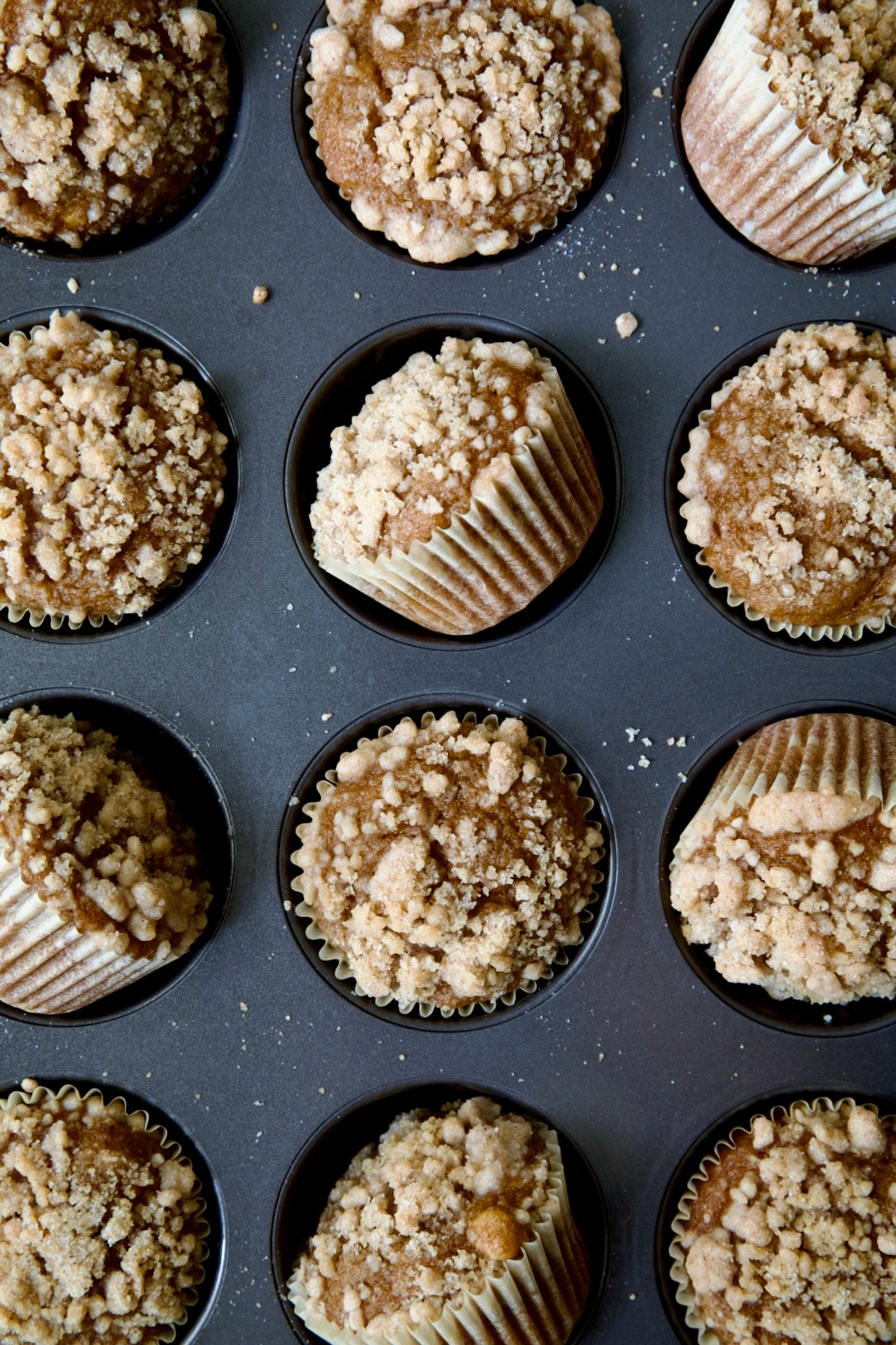 Pumpkin Streusel Muffins in muffin pan.