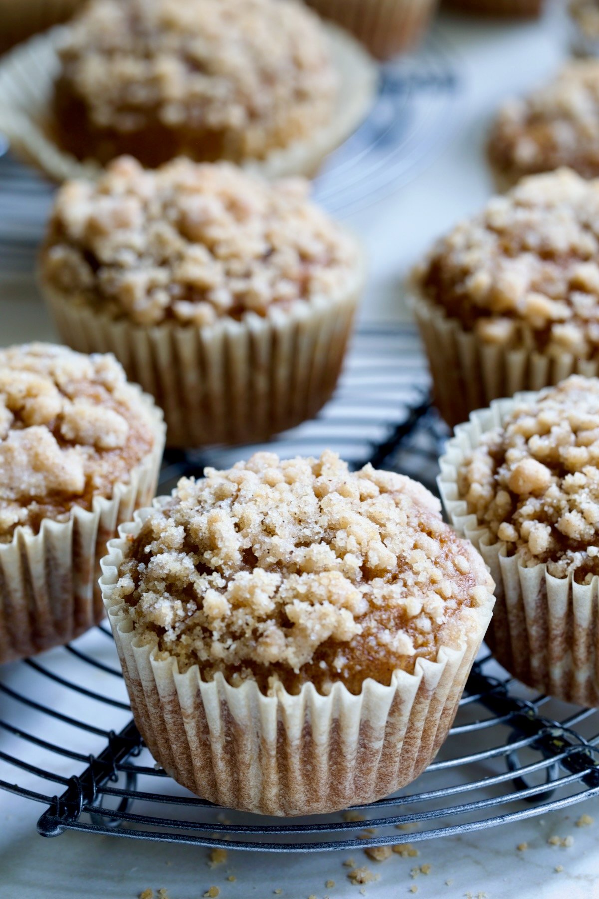 Pumpkin Streusel Muffins on round cooling rack.