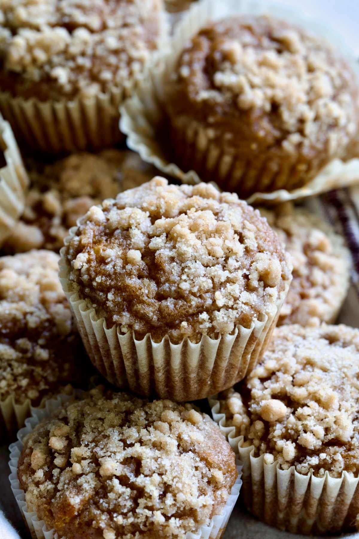 Stack of Pumpkin Streusel Muffins.