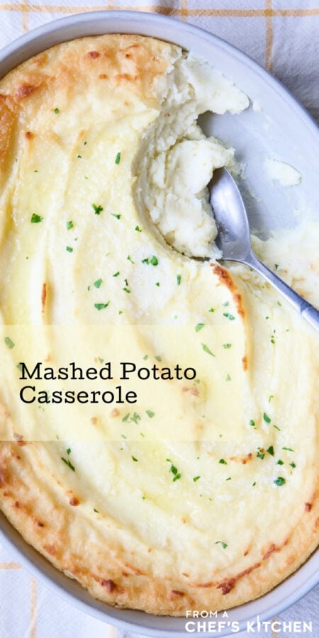 Pinterest graphic for Twice-Baked Mashed Potatoes showing them in an oval baking dish with serving spoon scooping some out.