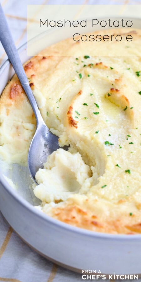 Pinterest graphic for Twice-Baked Mashed Potatoes showing them in an oval baking dish with serving spoon scooping some out.