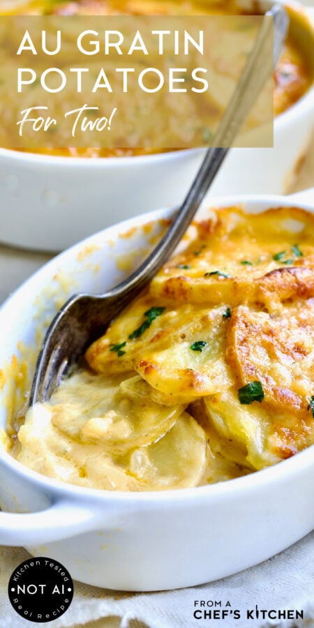 Pinterest graphic for Au Gratin Potatoes for Two showing one serving in an oval baking dish with fork.
