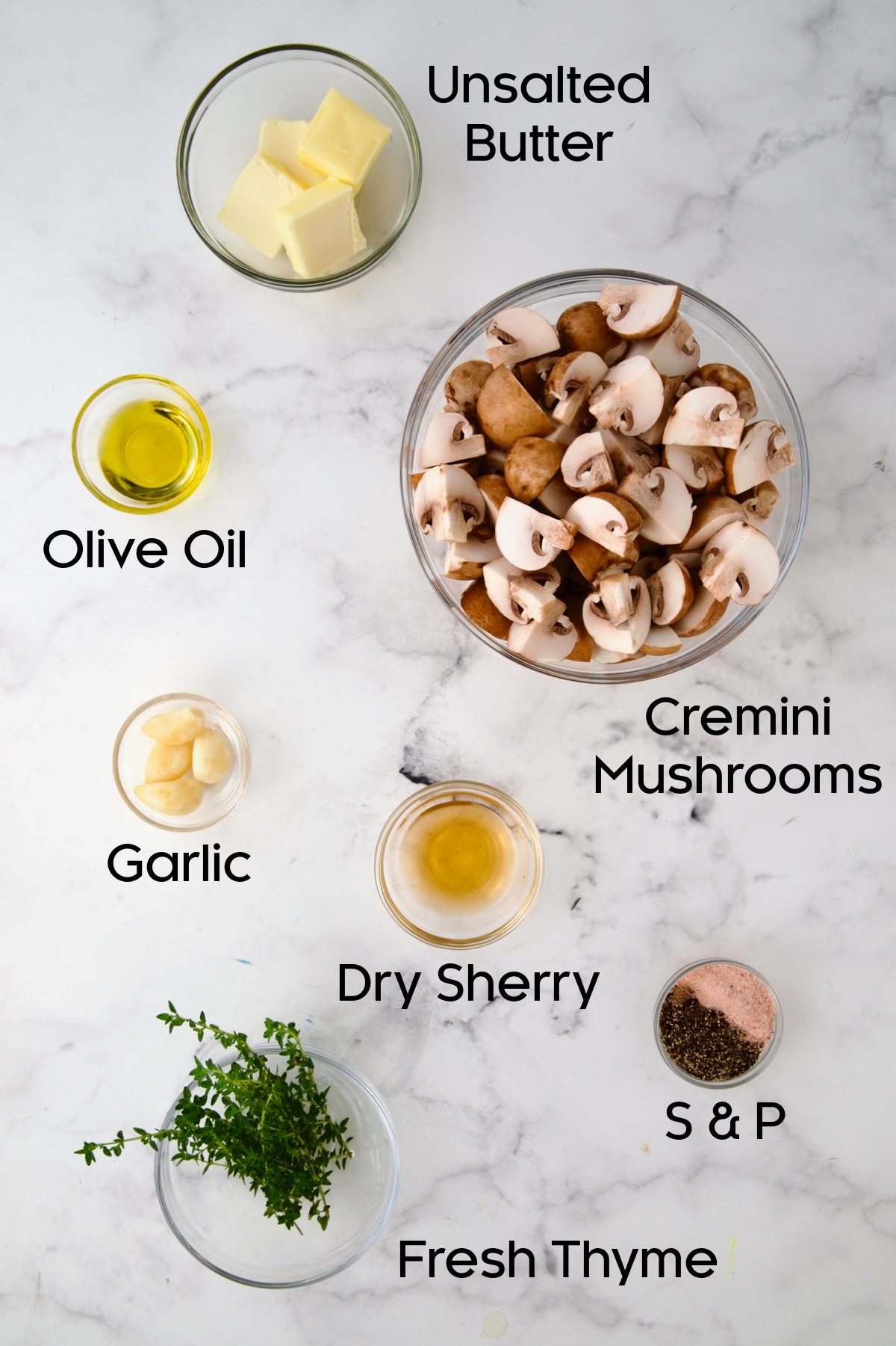 Ingredients for Garlic Butter Mushrooms in glass bowls.