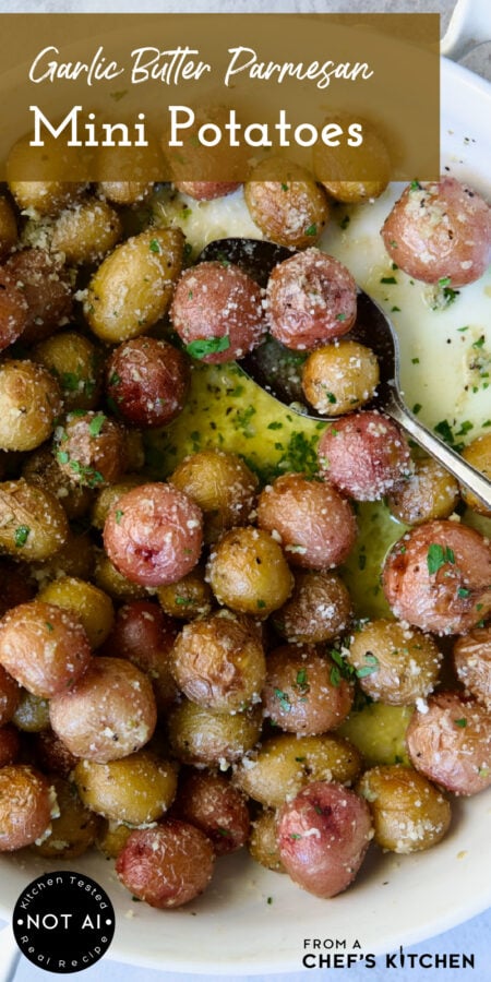 Pinterest graphic for Garlic Butter Parmesan Mini Potatoes showing them in a round white baking dish with three on a serving spoon.
