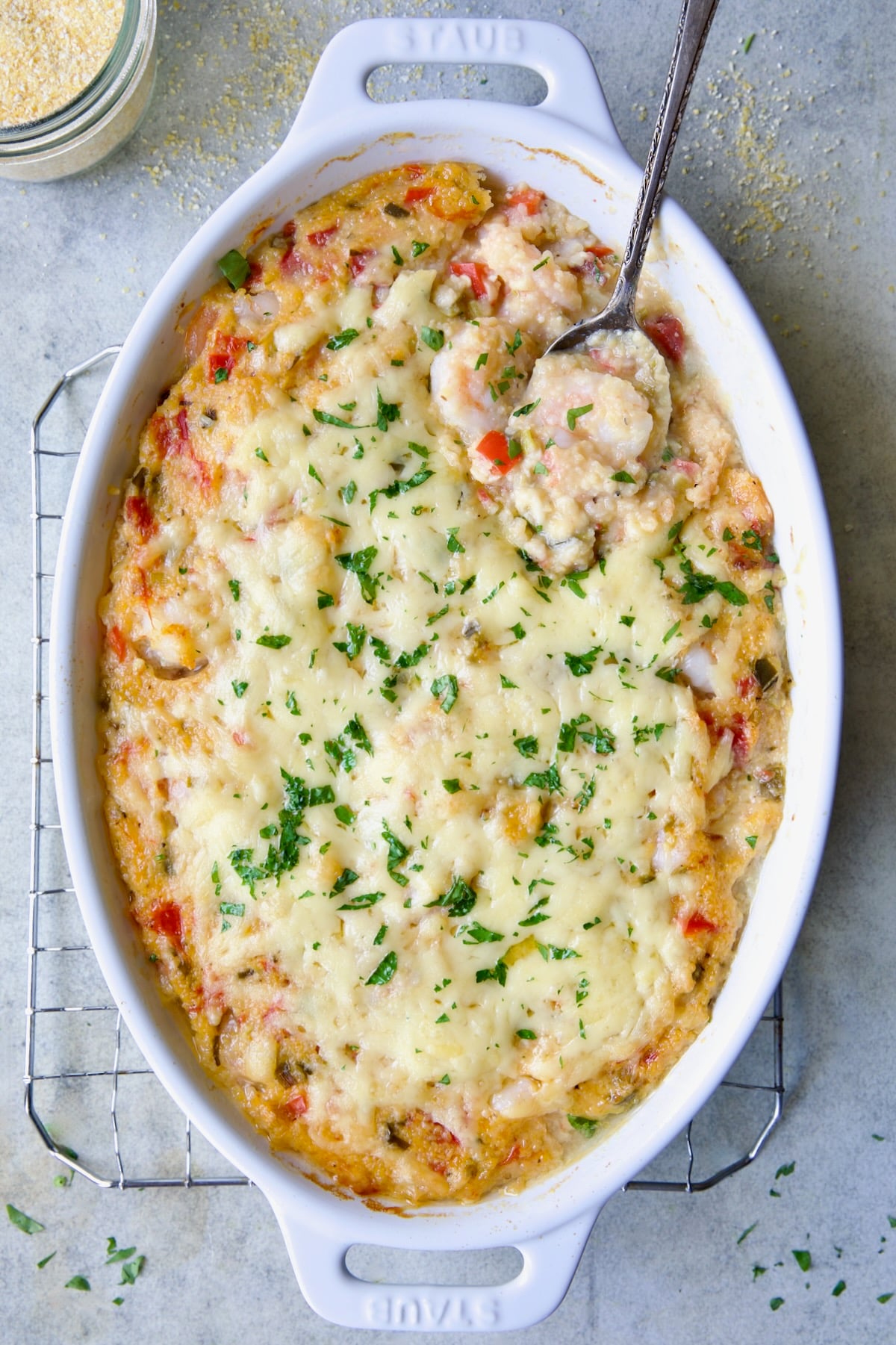 Shrimp and Grits Casserole in white Dutch oven.