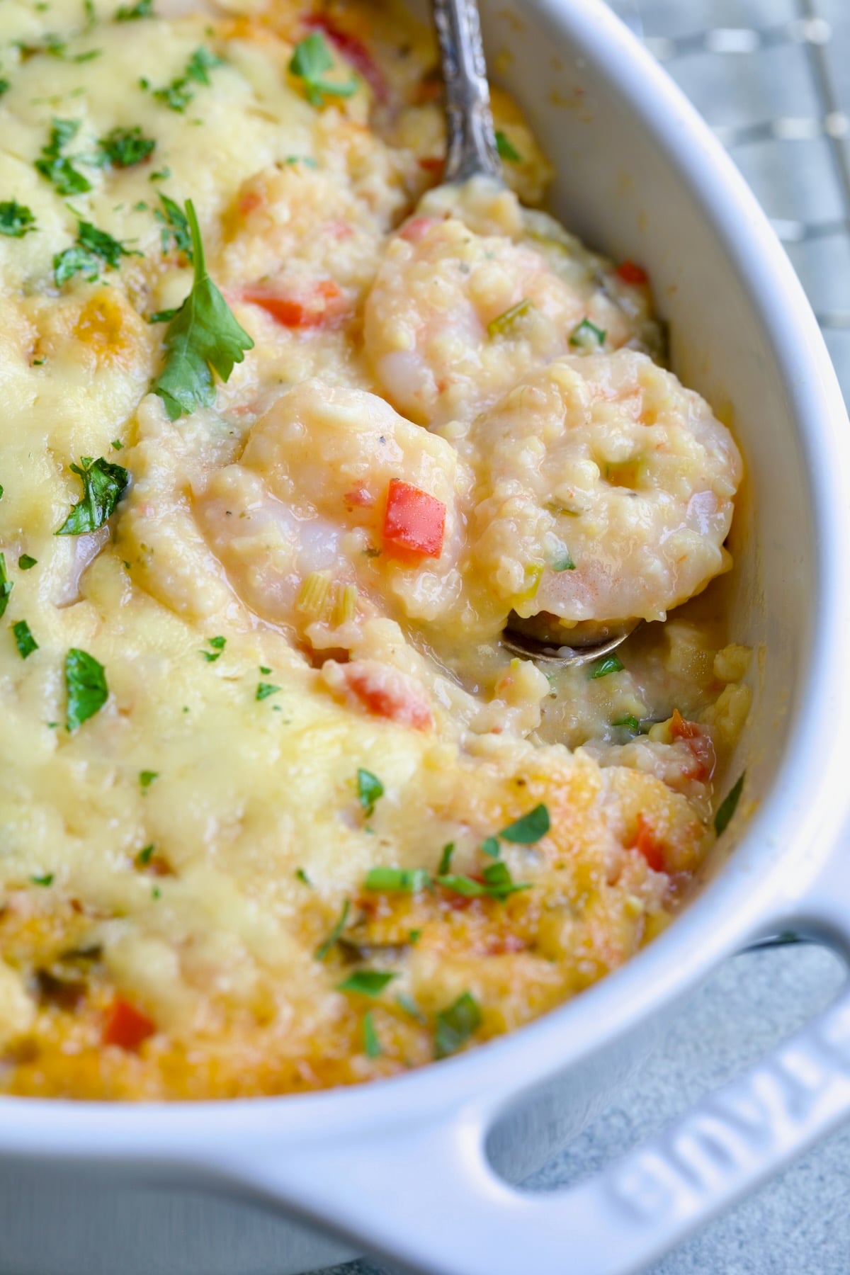 Shrimp and Grits Casserole in white Dutch oven.