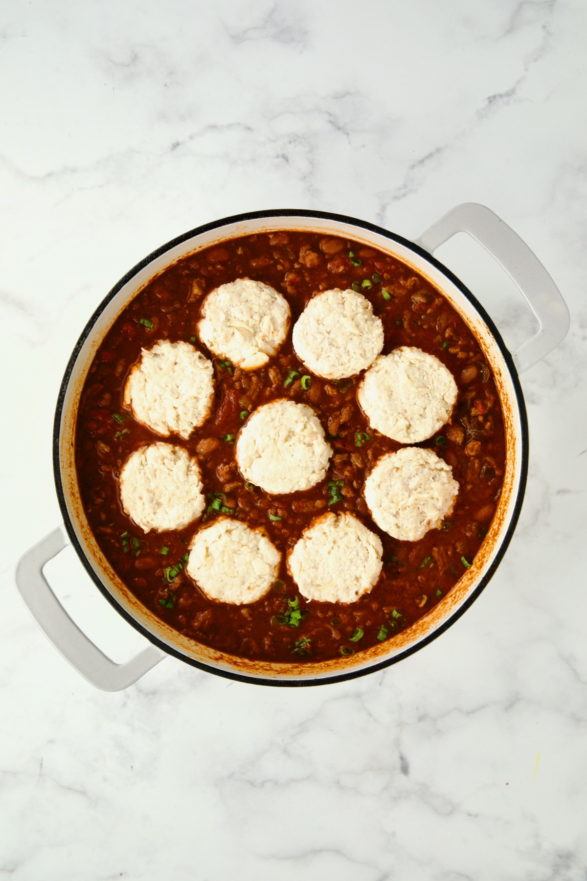 Chili with biscuit topping ready to go in the oven.