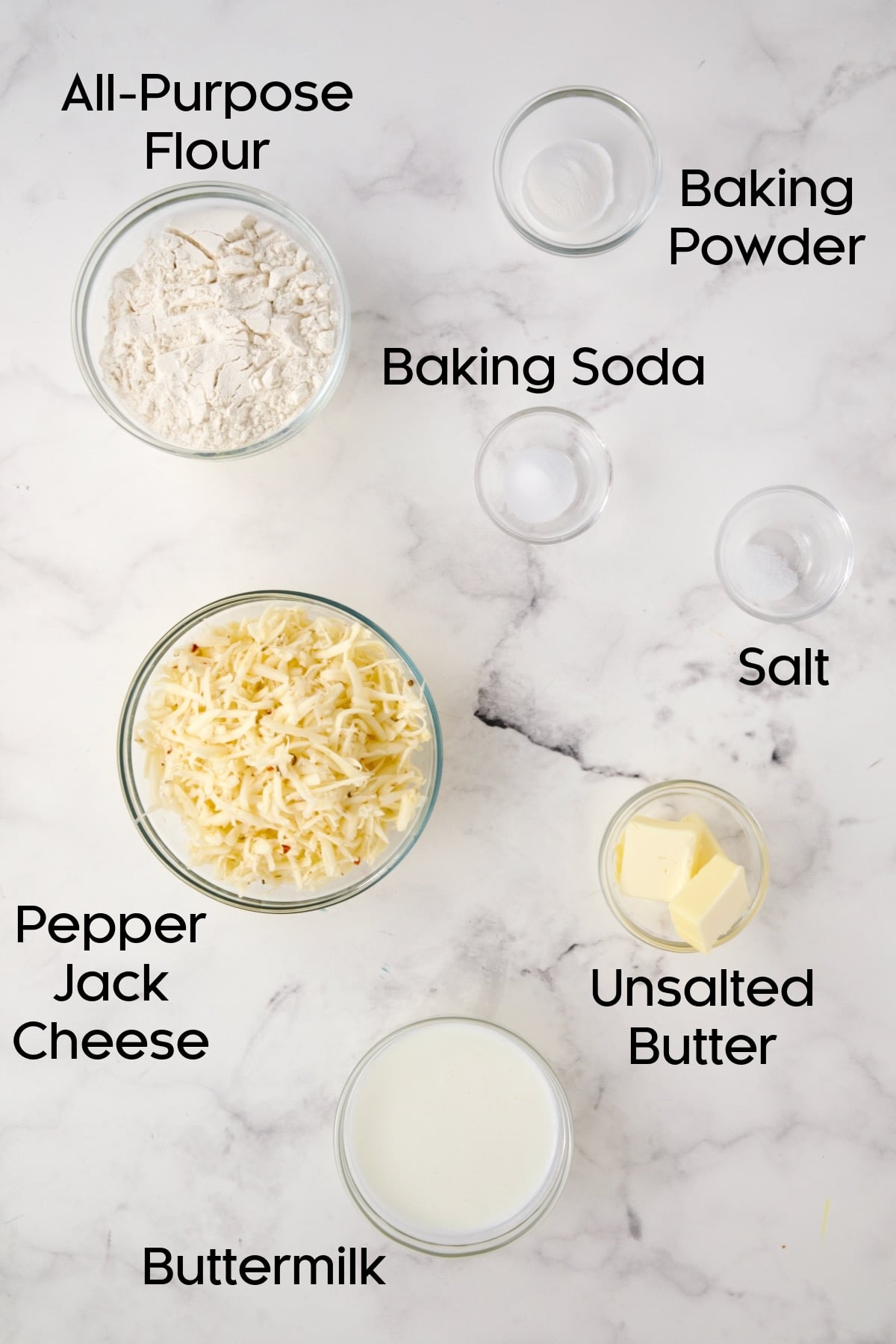 Ingredients for biscuits in glass bowls.