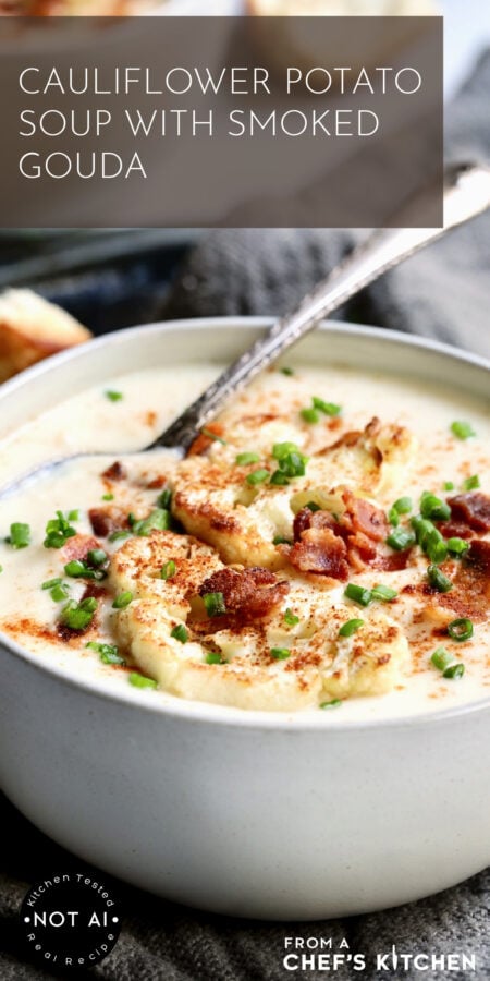 Pinterest graphic for Cauliflower Potato Soup with Smoked Gouda showing one serving in a white bowl with soup spoon.
