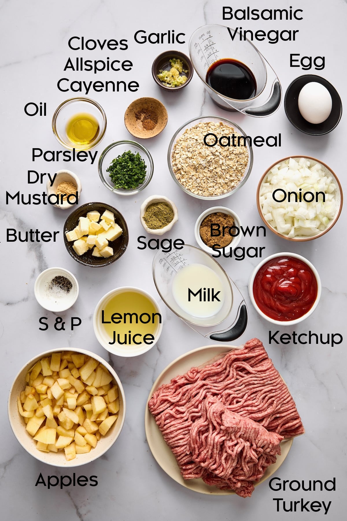 Ingredients for Turkey Apple Meatloaf with Balsamic Ketchup Glaze in various small bowls.