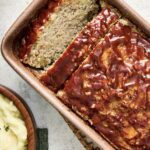 Turkey Apple Meatloaf with Balsamic Ketchup Glaze in brown loaf pan.