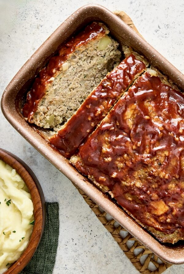 Turkey Apple Meatloaf with Balsamic Ketchup Glaze in brown loaf pan.