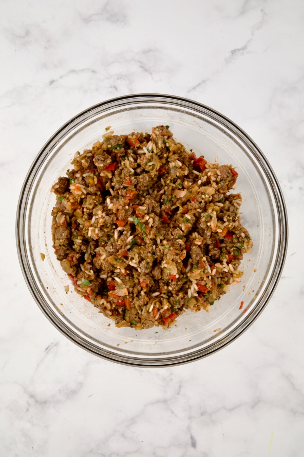 Filling for Stuffed Eggplant in glass bowl before after mixed together.