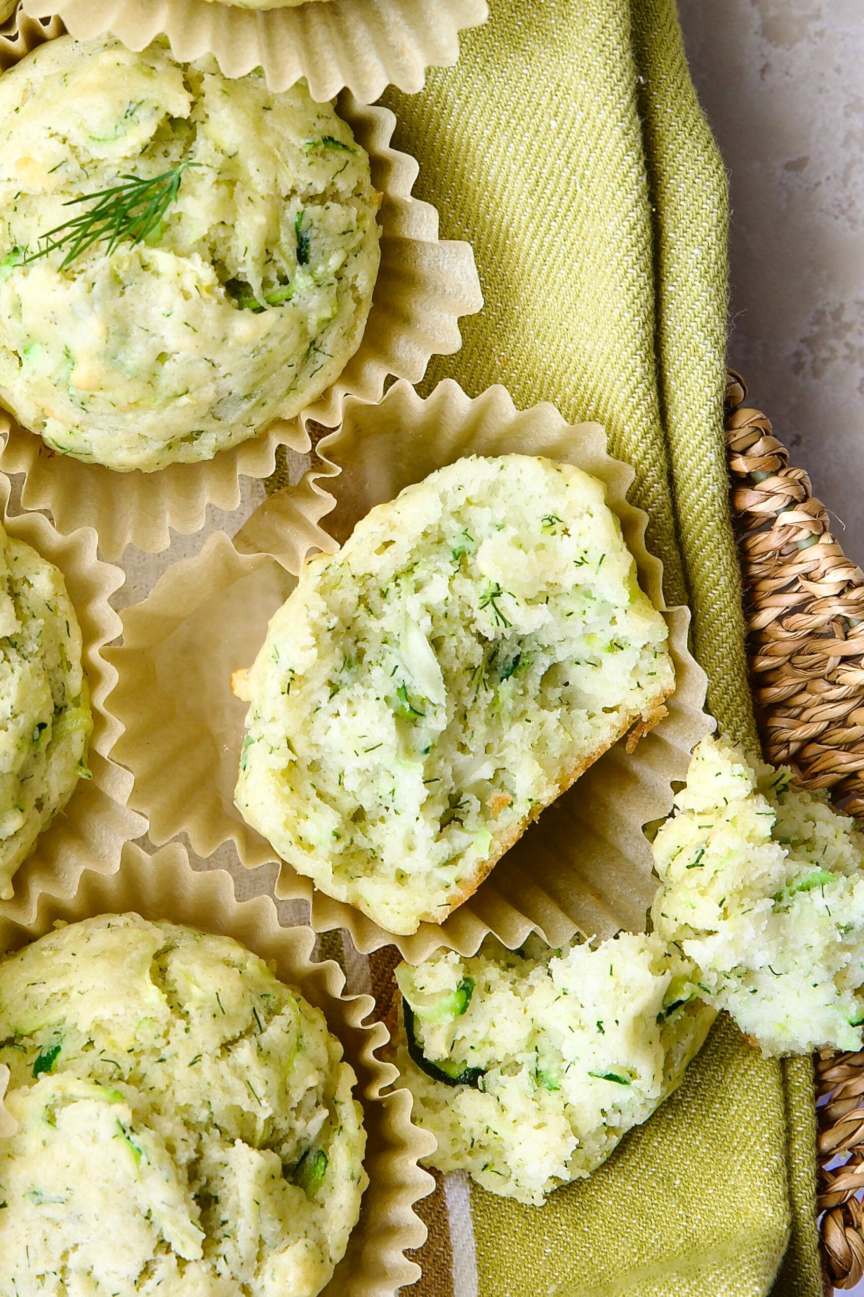 Close-up of Dill Zucchini and Ricotta Muffin broken into pieces.