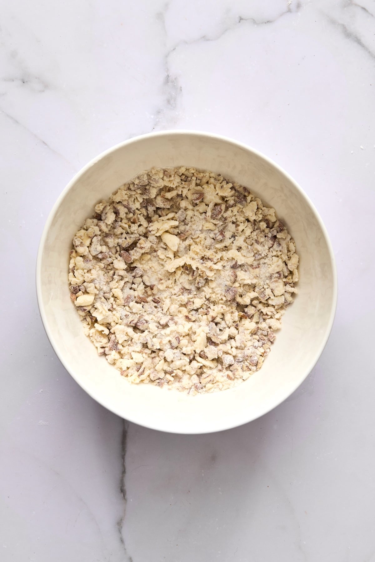Streusel topping for coffee cake in white bowl.