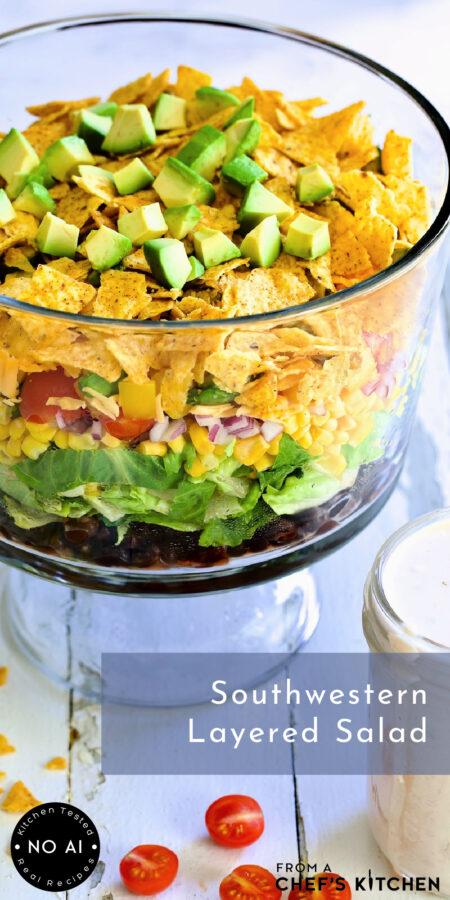 Pinterest graphic for Southwestern Layered Salad showing it in a footed glass bowl.