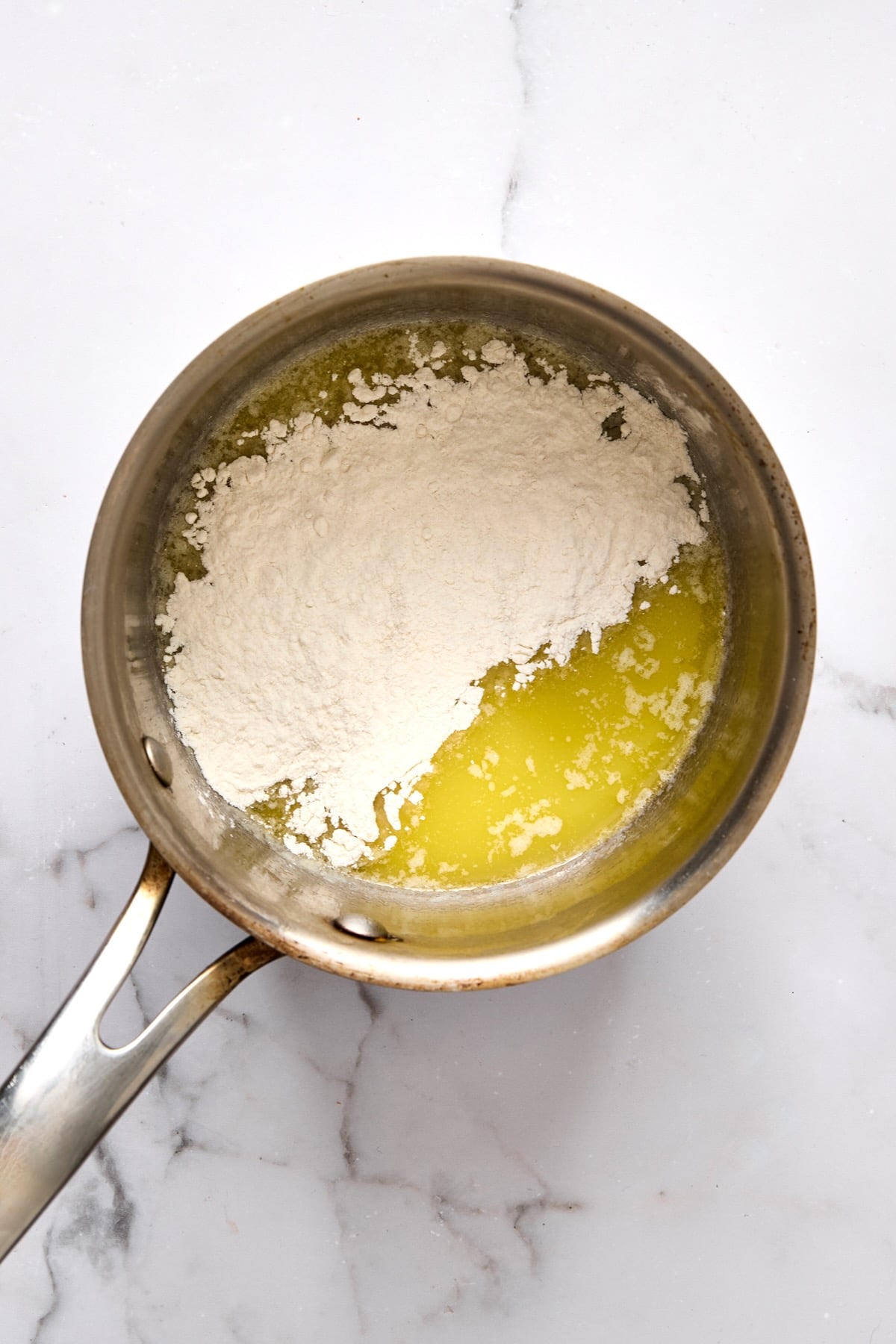 Butter and flour in stainless steel saucepan.