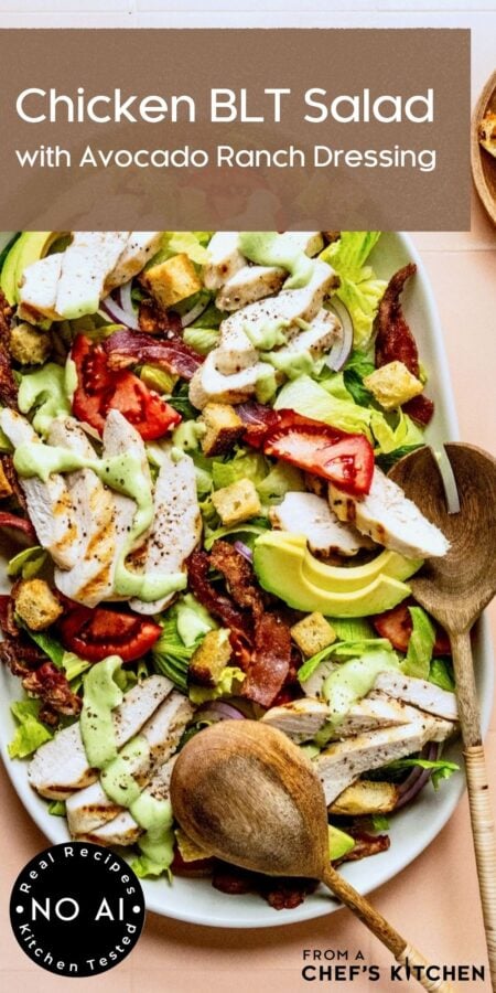 Pinterest graphic for Chicken BLT Salad showing it on a white oval platter with wooden utensils.