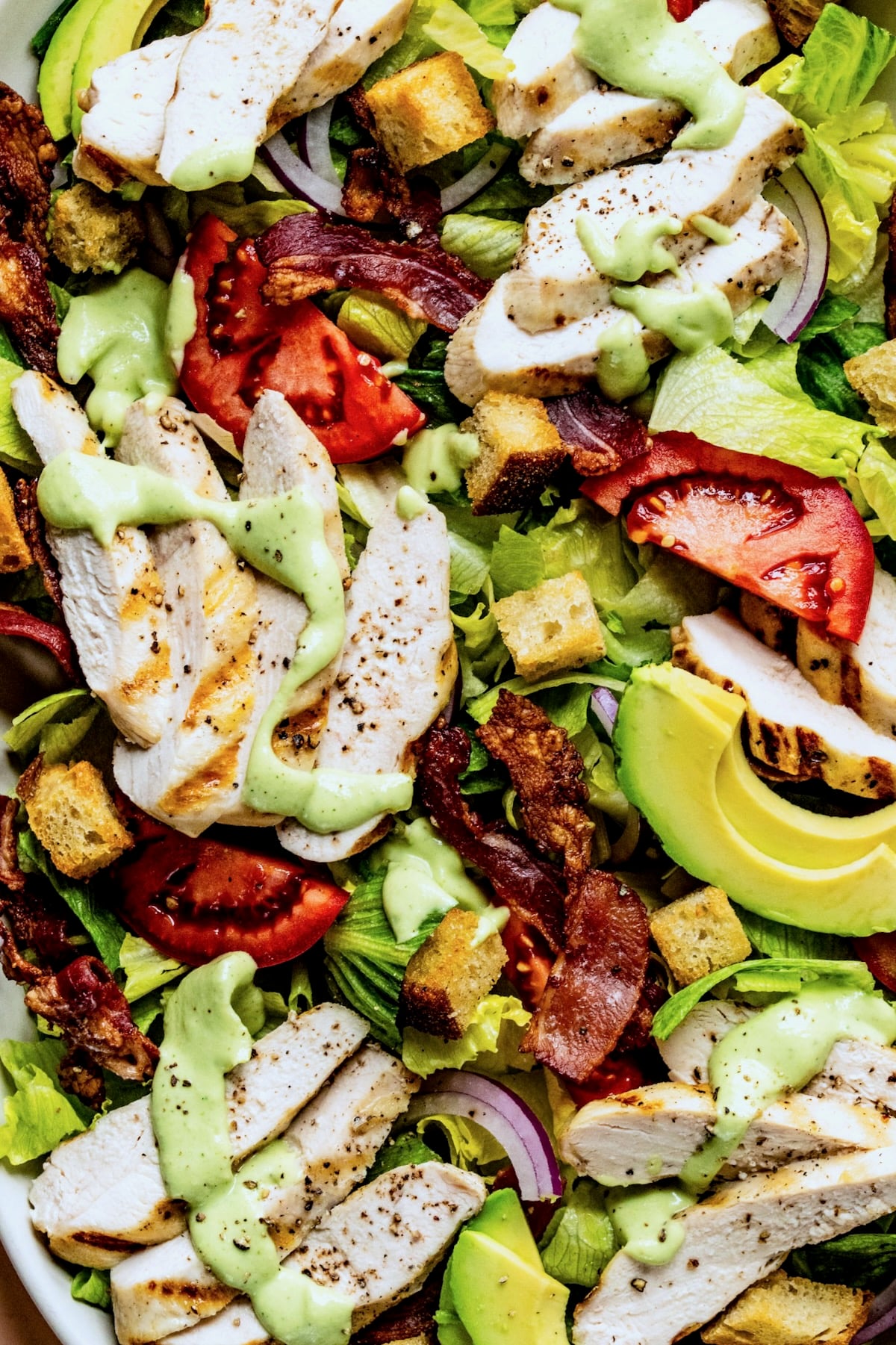 Close-up of Chicken BLT Salad on white platter.