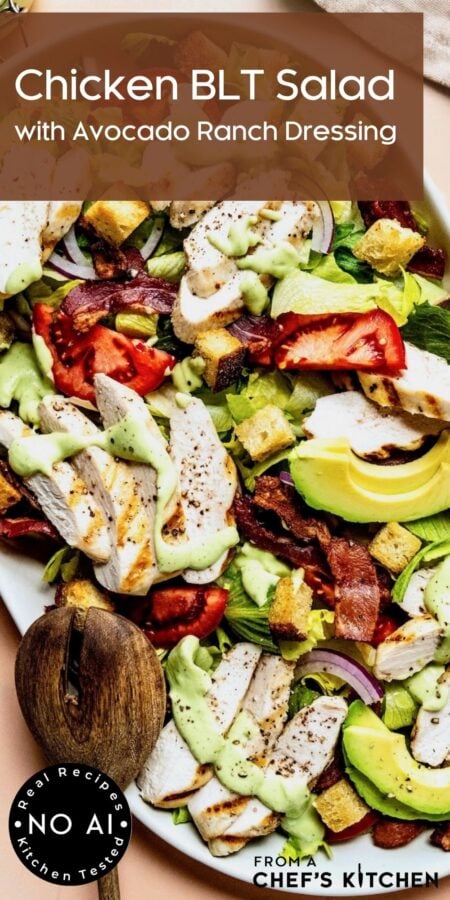 Pinterest graphic for Chicken BLT Salad showing it on a white oval platter with wooden utensils.