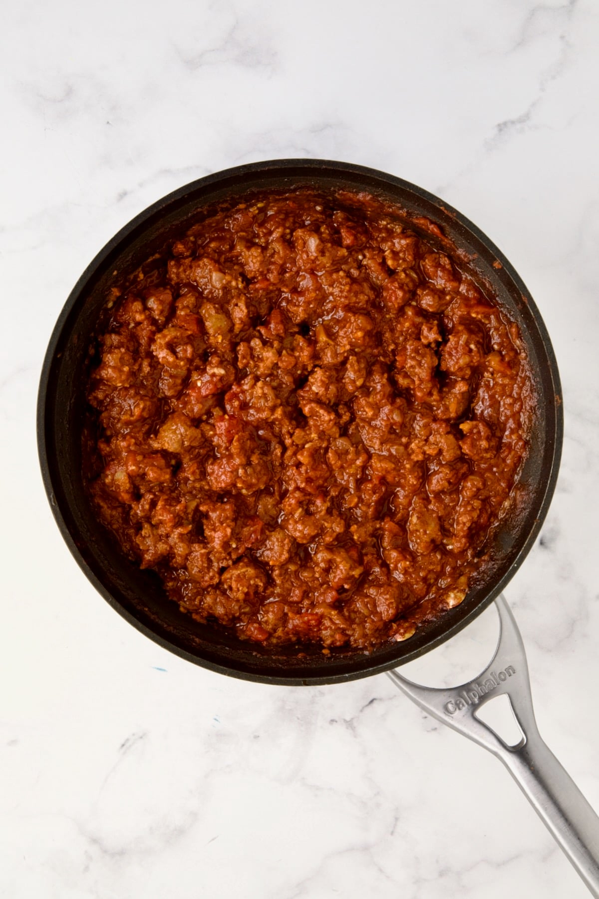 Cooked chorizo filling in nonstick skillet.