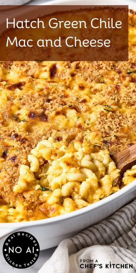 Pinterest graphic for Hatch Green Chile Mac and Cheese showing it in a white baking dish with a wooden spoon scooping some up.