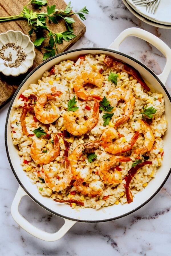 Shrimp and Corn Risotto in white enamel cast iron skillet.
