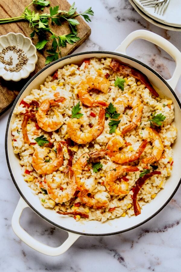 Shrimp and Corn Risotto in white enamel cast iron skillet.