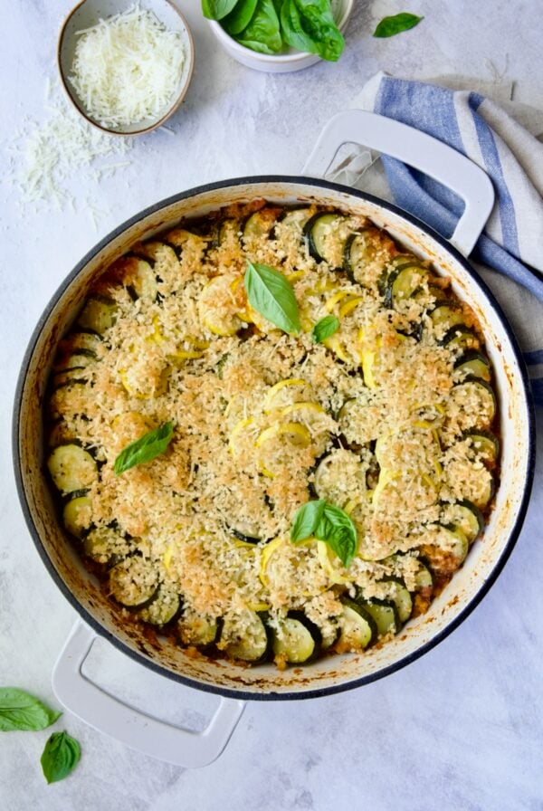 Summer Vegetable Cassoulet in white enamel cast iron skillet.
