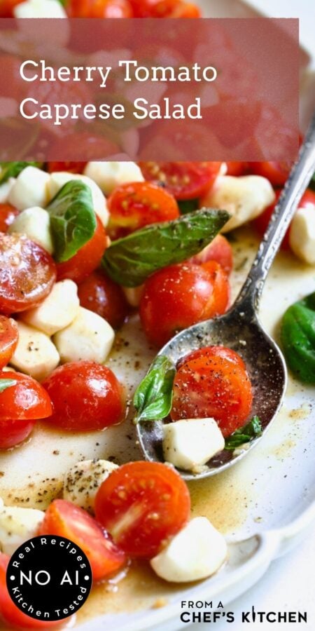Pinterest graphic for Cherry Tomato Caprese Salad showing it on a white platter with serving spoon.
