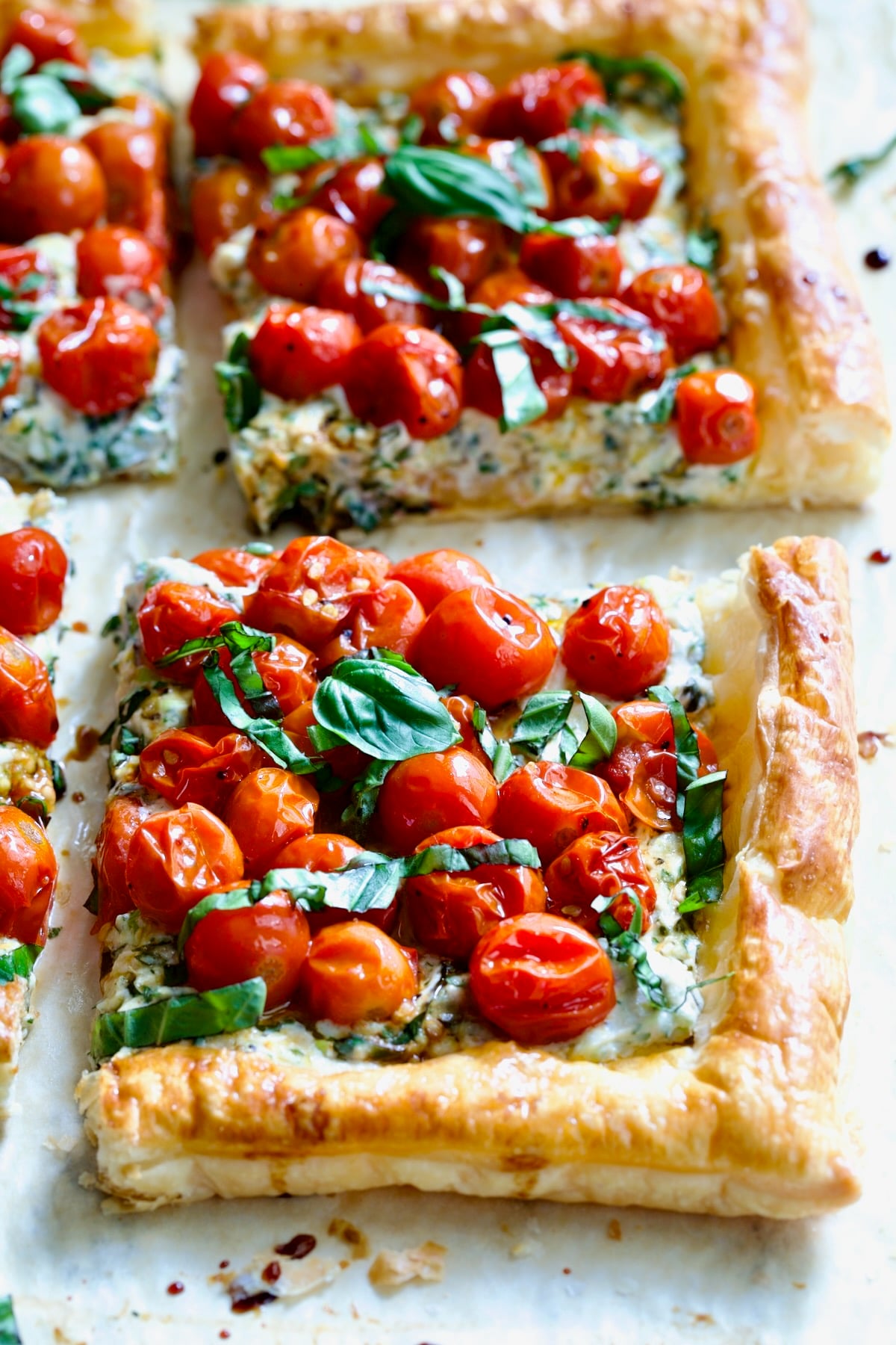 Two pieces of Cherry Tomato Puff Pastry Tart.