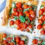Cherry Tomato Puff Pastry Tart cut into four pieces.