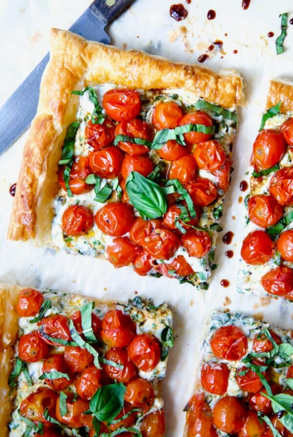 Cherry Tomato Puff Pastry Tart cut into four pieces.