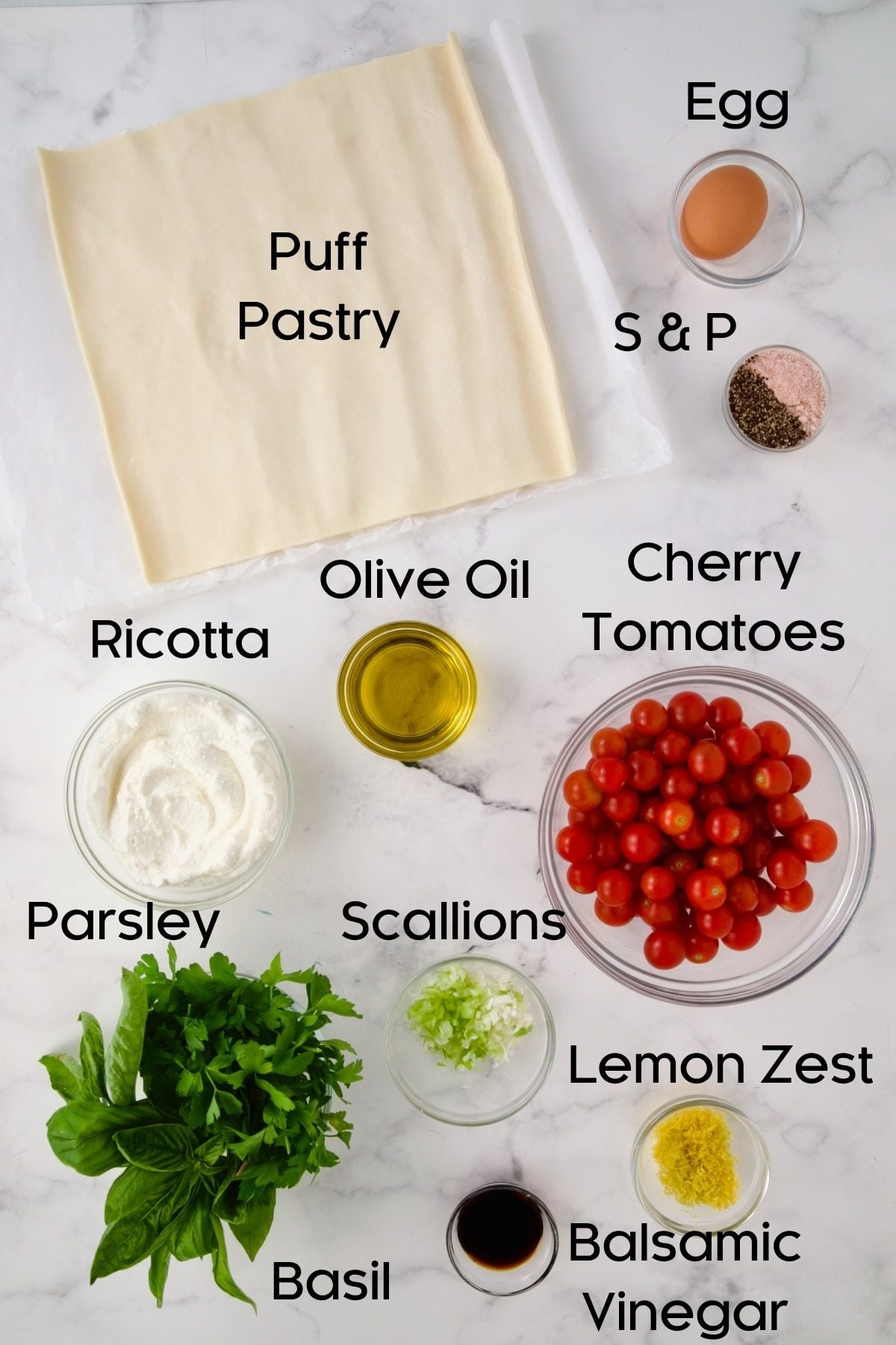 Ingredients for Cherry Tomato Puff Pastry Tart in glass bowls.