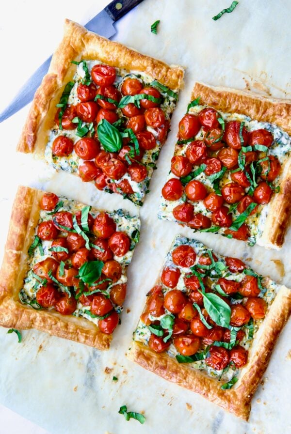 Cherry Tomato Puff Pastry Tart cut into four pieces.