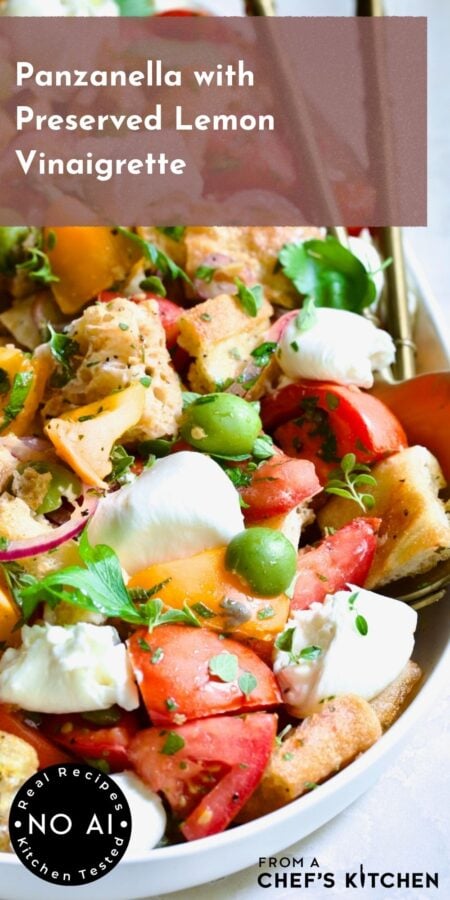 Pinterest graphic for Panzanella with Preserved Lemon Vinaigrette showing it on a white oval platter with gold serving utensils.
