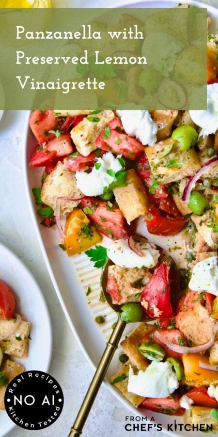 Pinterest graphic for Panzanella with Preserved Lemon Vinaigrette showing it on a white oval platter with gold serving utensil.
