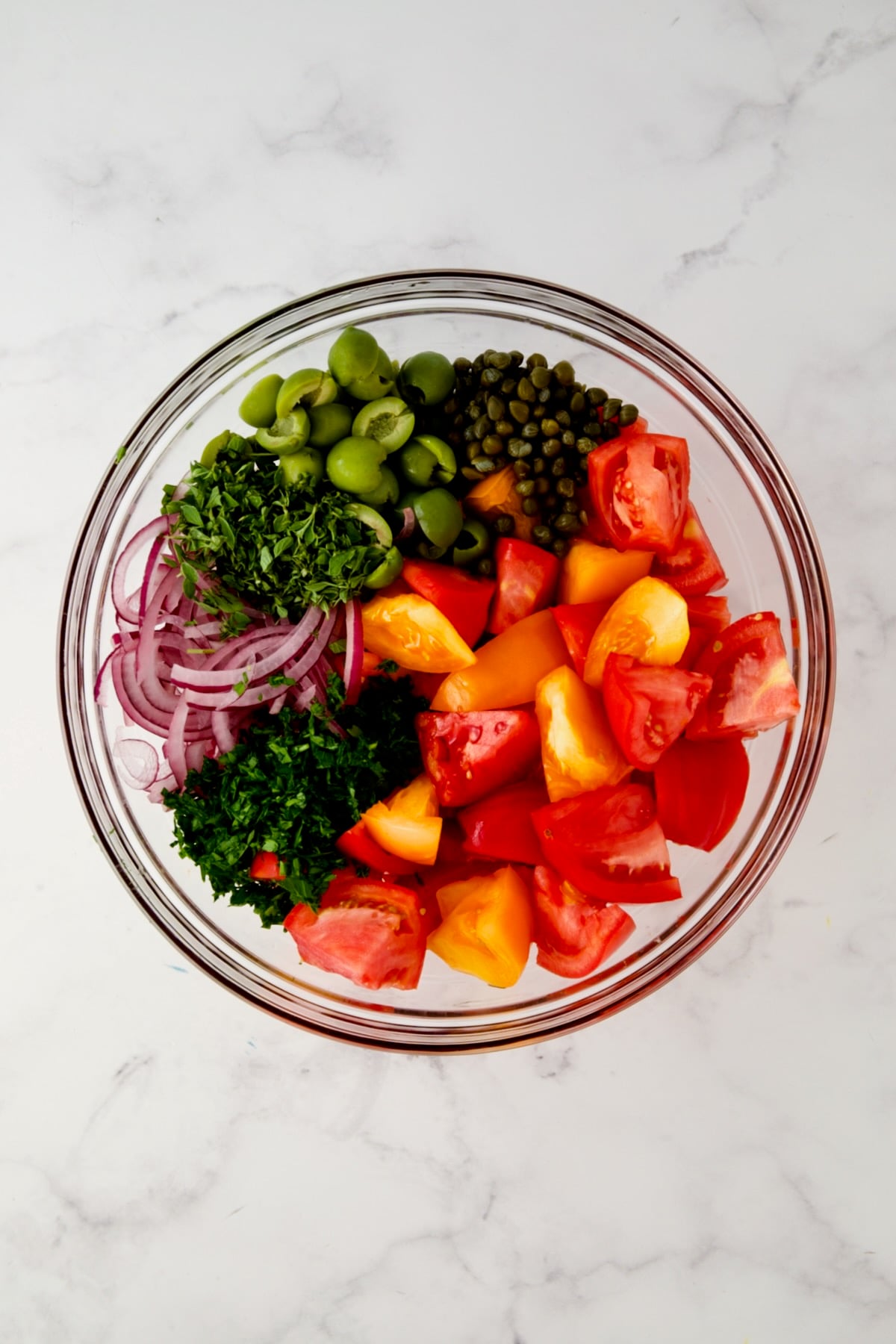 Ingredients for Panzanella in glass bowl before being combined.