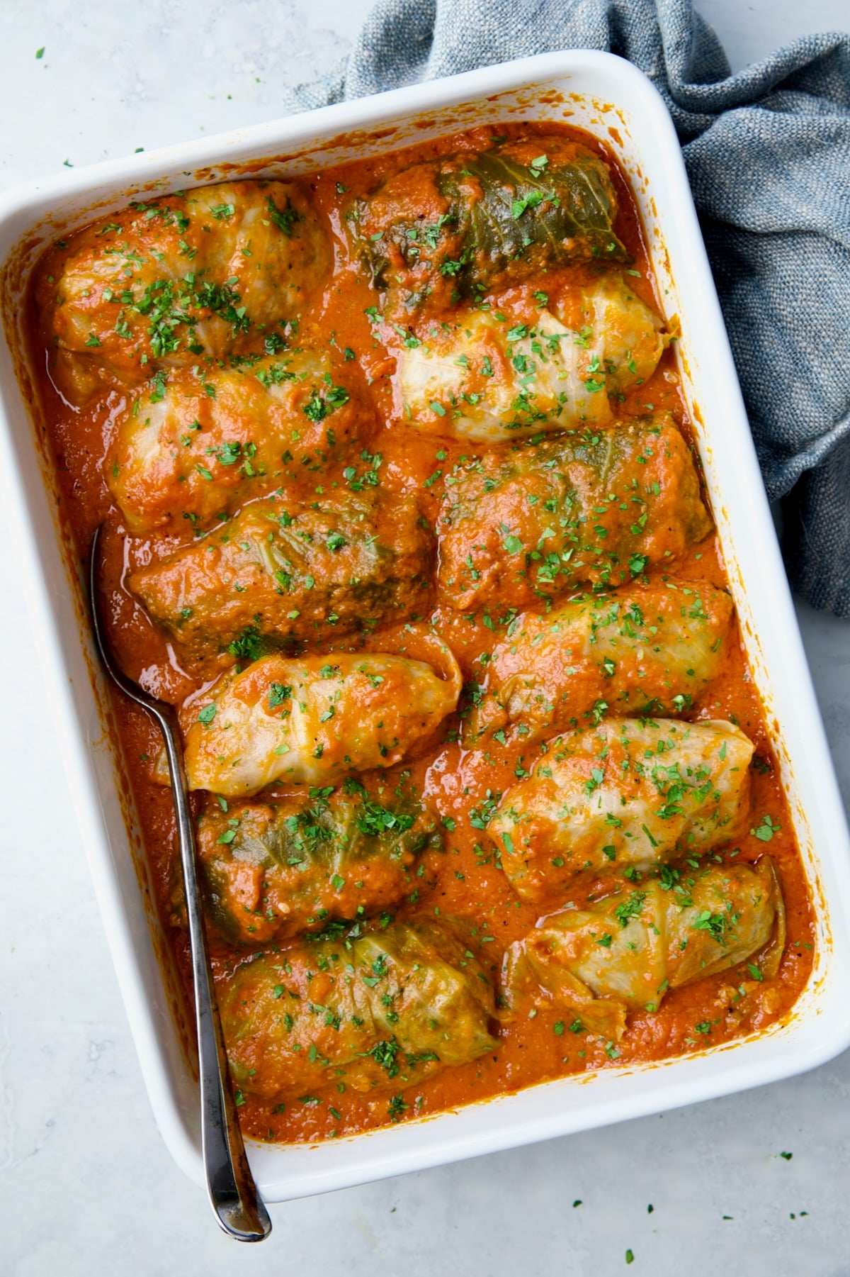 Cooked Golumpki in white rectangular baking dish.