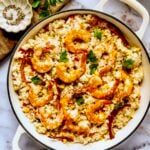 Shrimp and Corn Risotto in white enamel cast iron skillet.