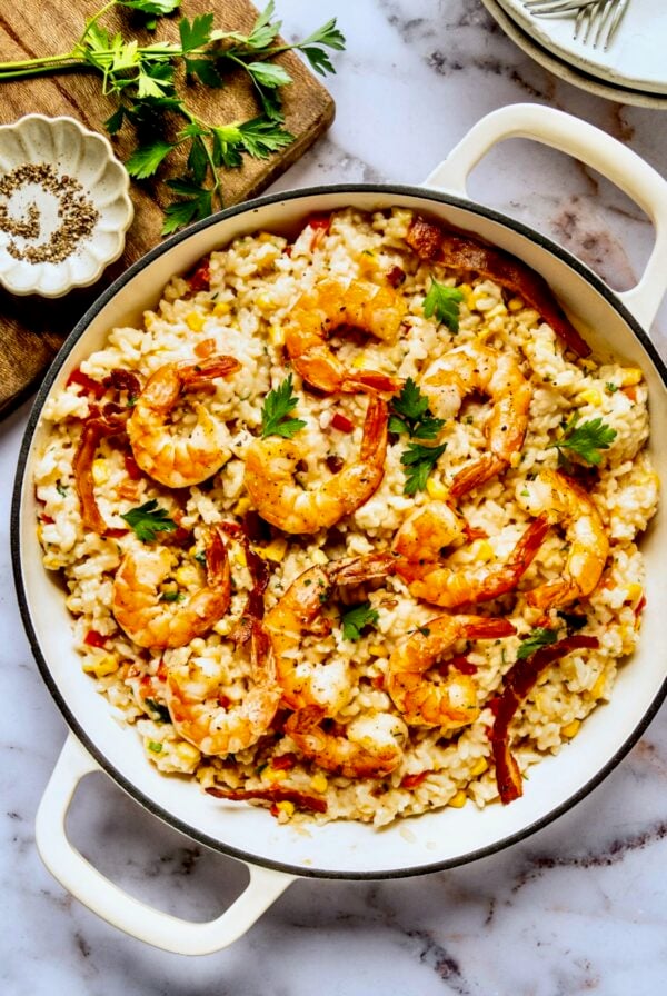 Shrimp and Corn Risotto in white enamel cast iron skillet.
