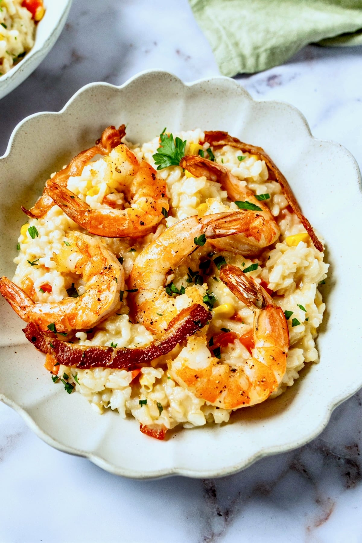 One serving of Shrimp and Corn Risotto in white bowl.