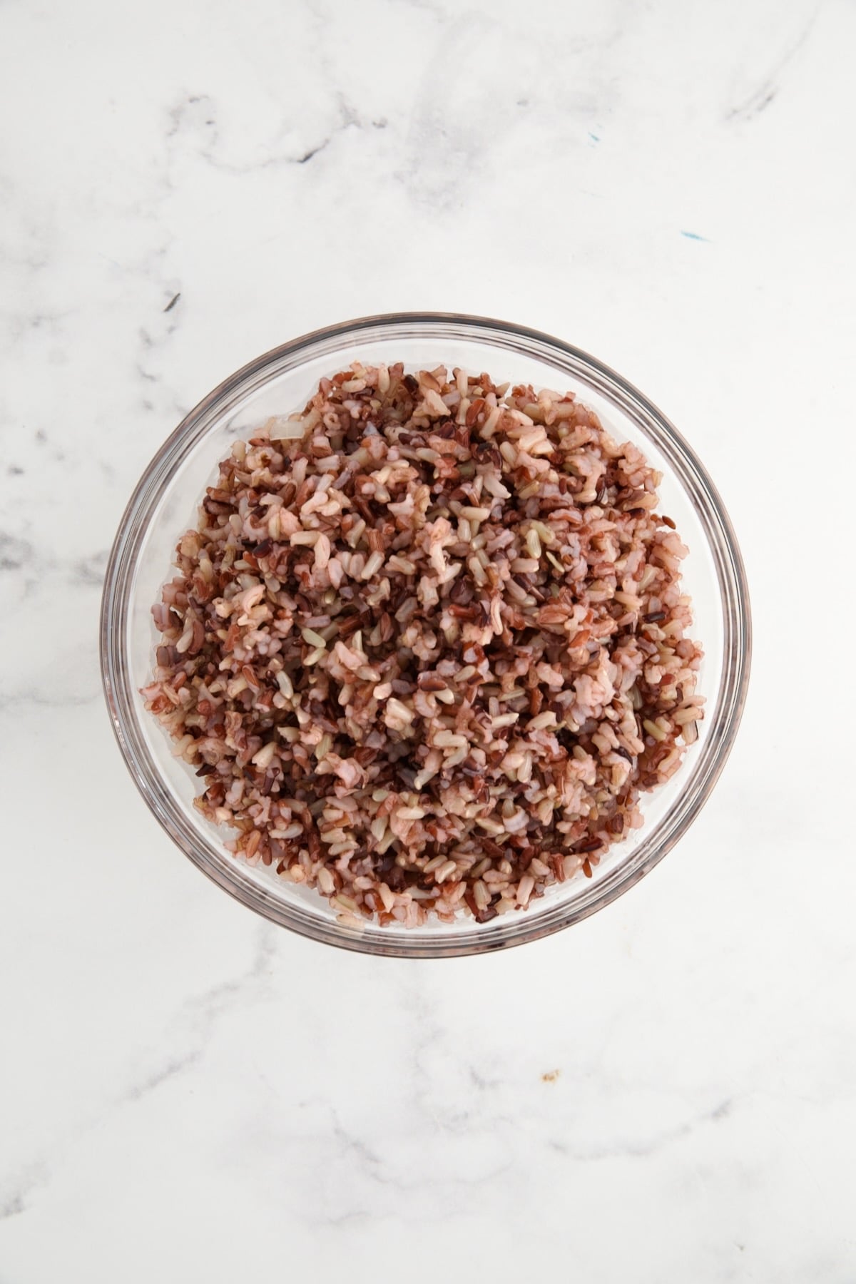 Cooked wild rice blend in glass bowl.