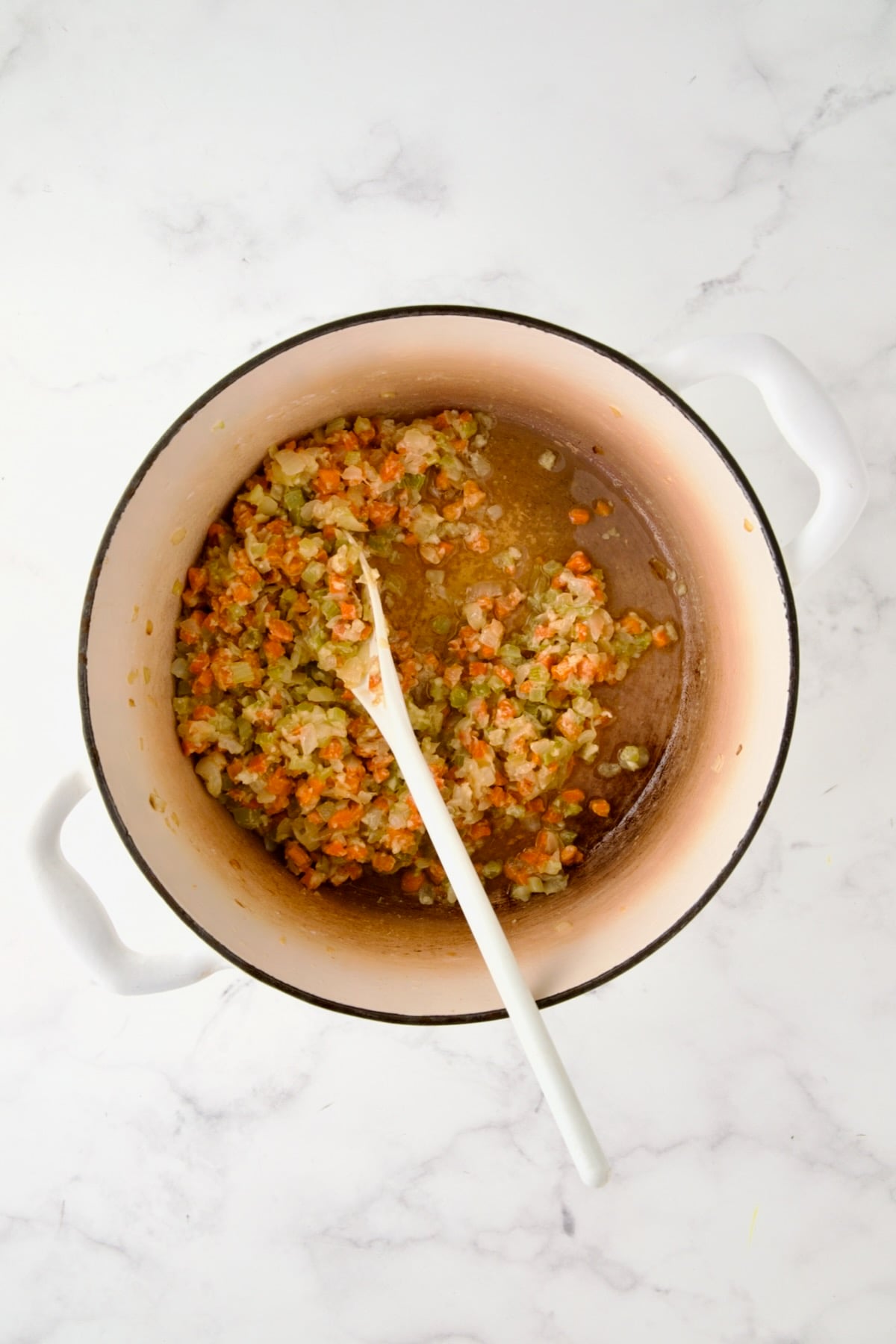Cooked onion, carrot and celery in white enamel Dutch oven with flour stirred in and dry sherry added.