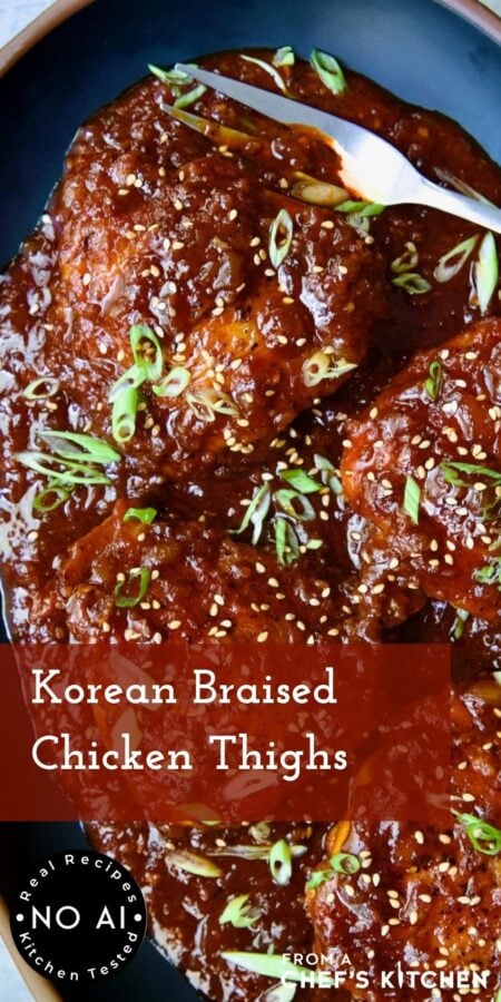 Pinterest graphic for Korean Braised Chicken Thighs showing them on an oval black platter with meat fork.